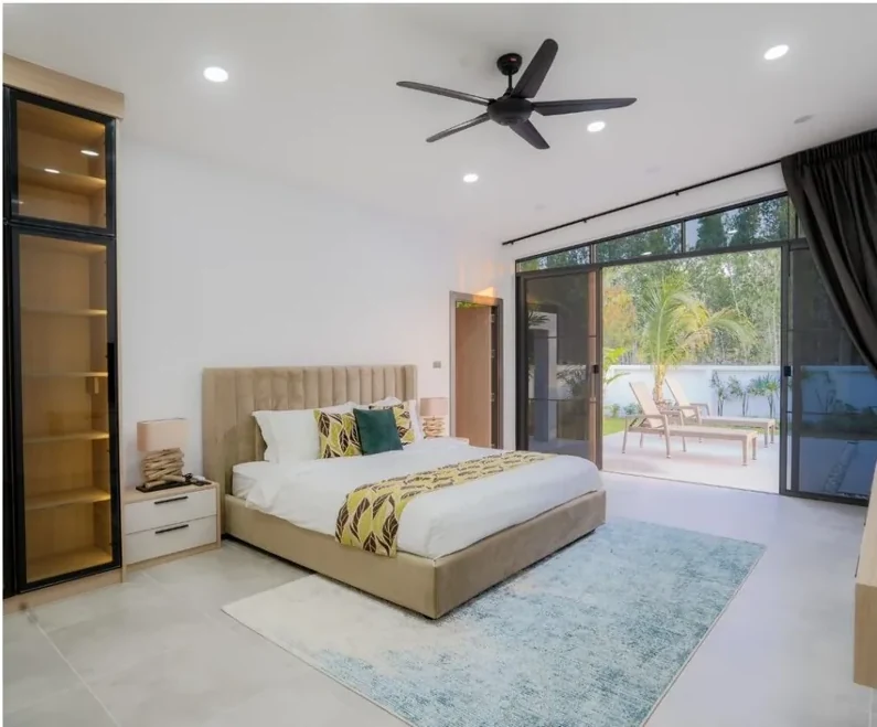 Main bedroom of a Moda villa with sliding doors to the pool terrace